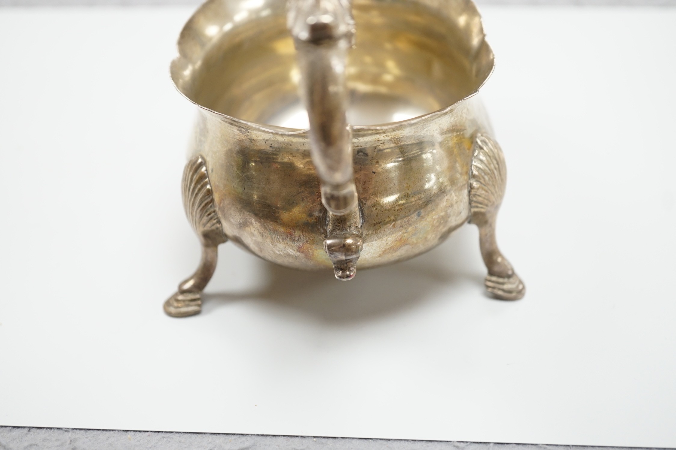 A William IV silver sauceboat, with flying scroll handle, Michael Starkey, London, 1831, length 17.8cm, 8.6oz.